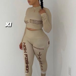Two piece tan with brown writing in a size xl pants set.